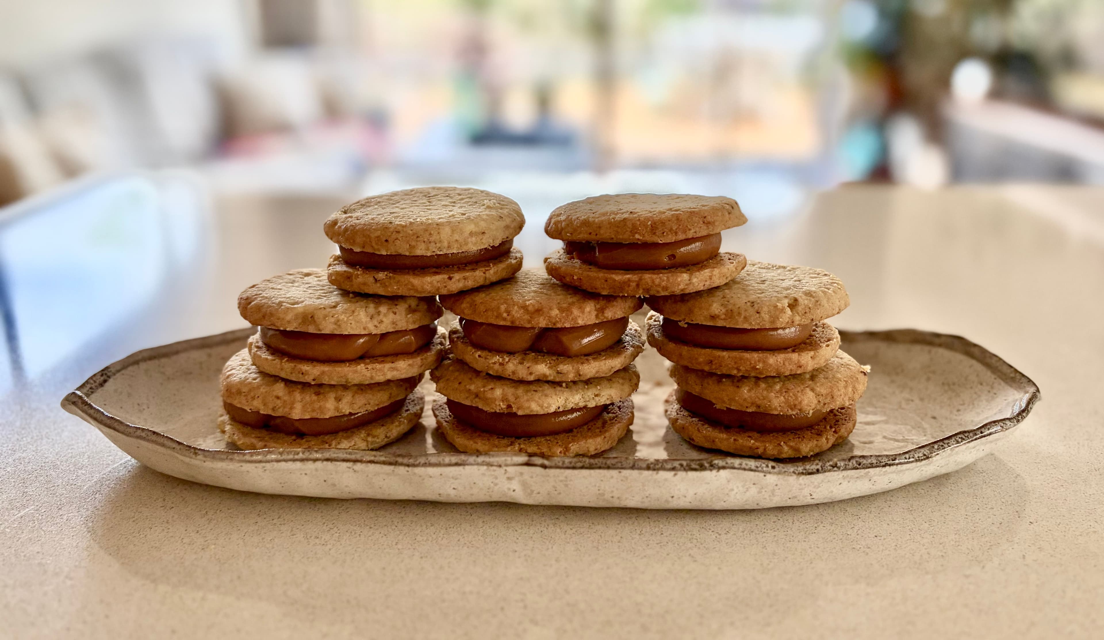 Walnut alfajores with dulce de leche filling