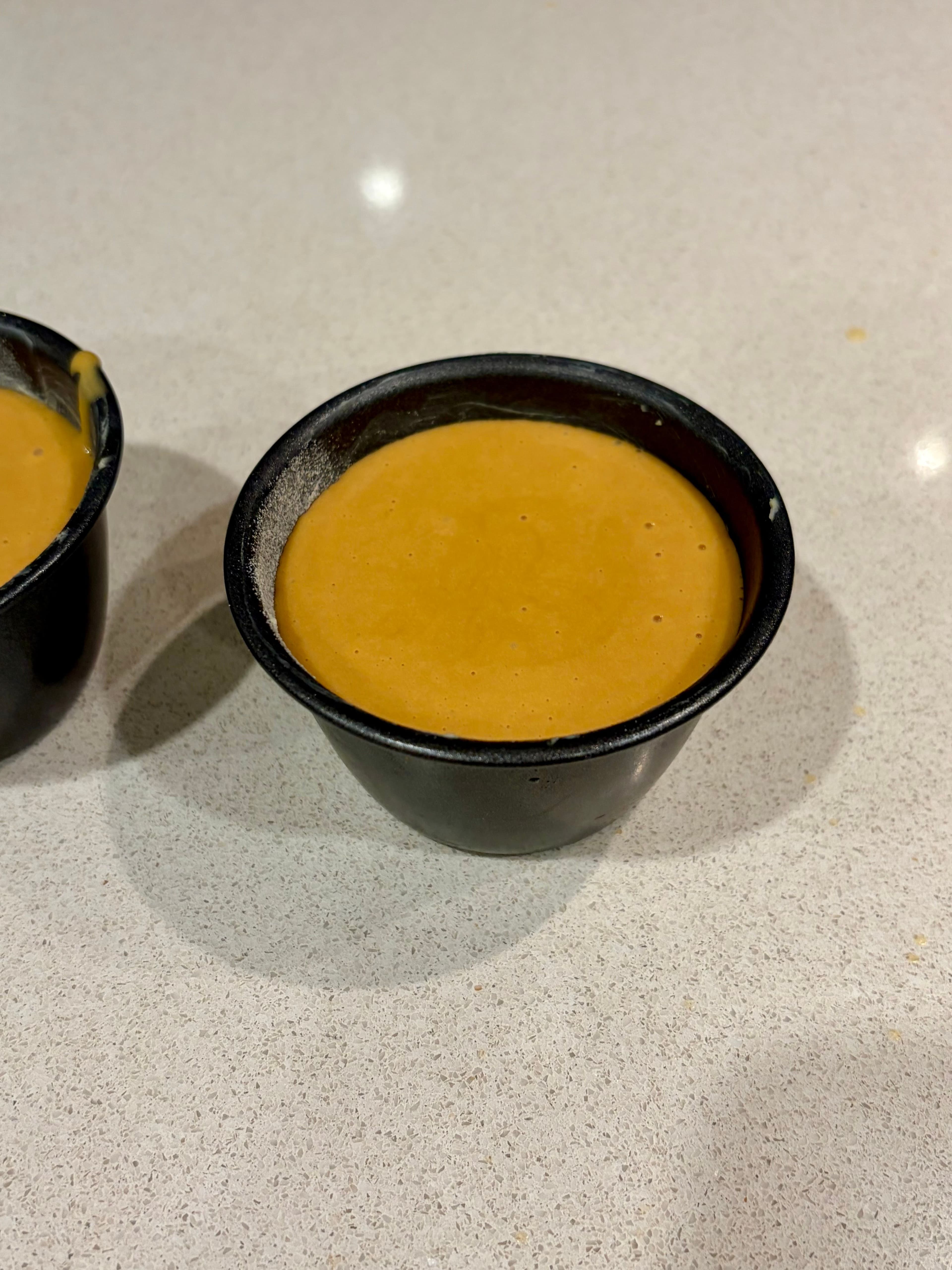 Six ramekins ready to bake