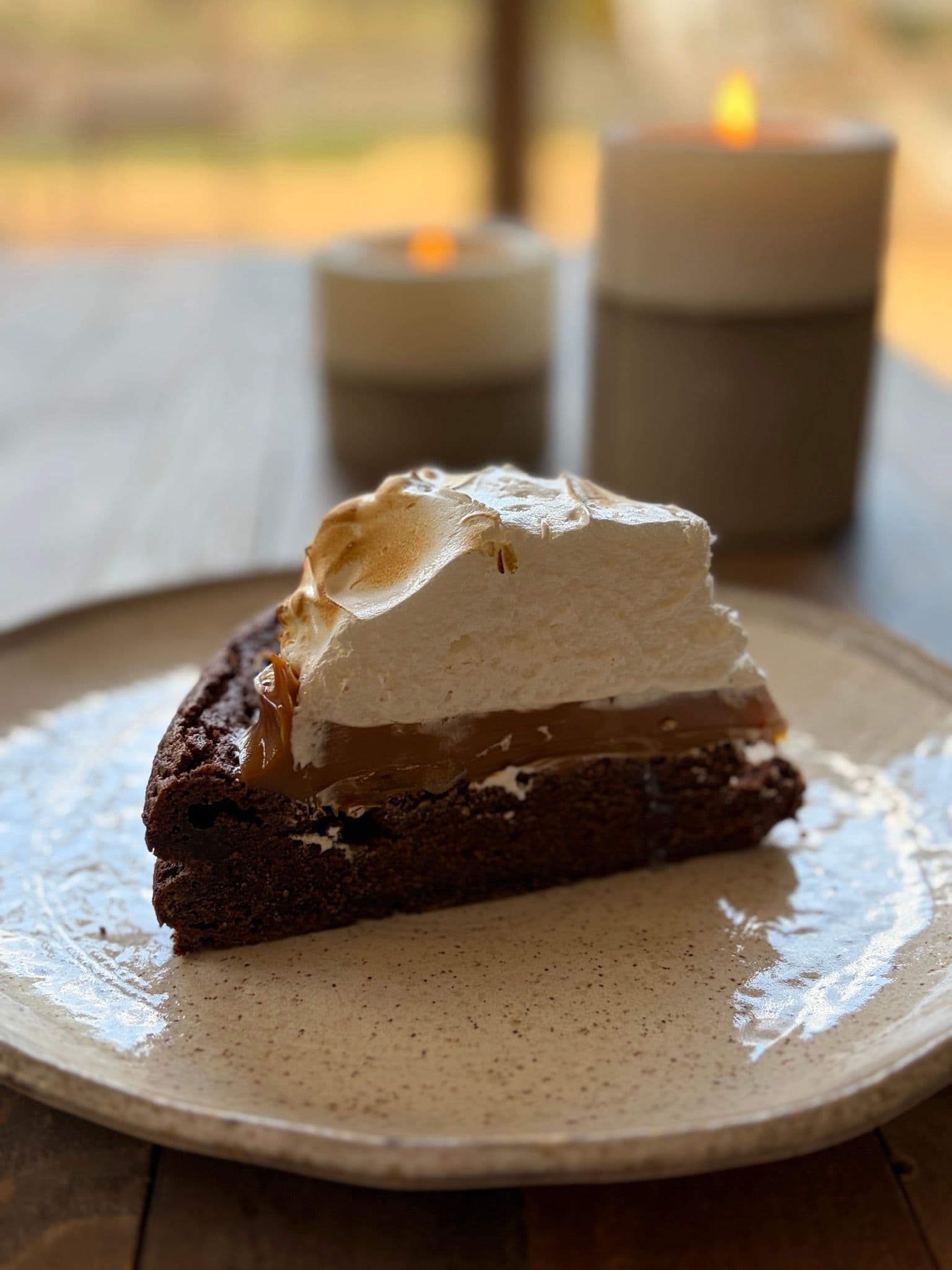 A slice of marquise showing the dulce de leche layer