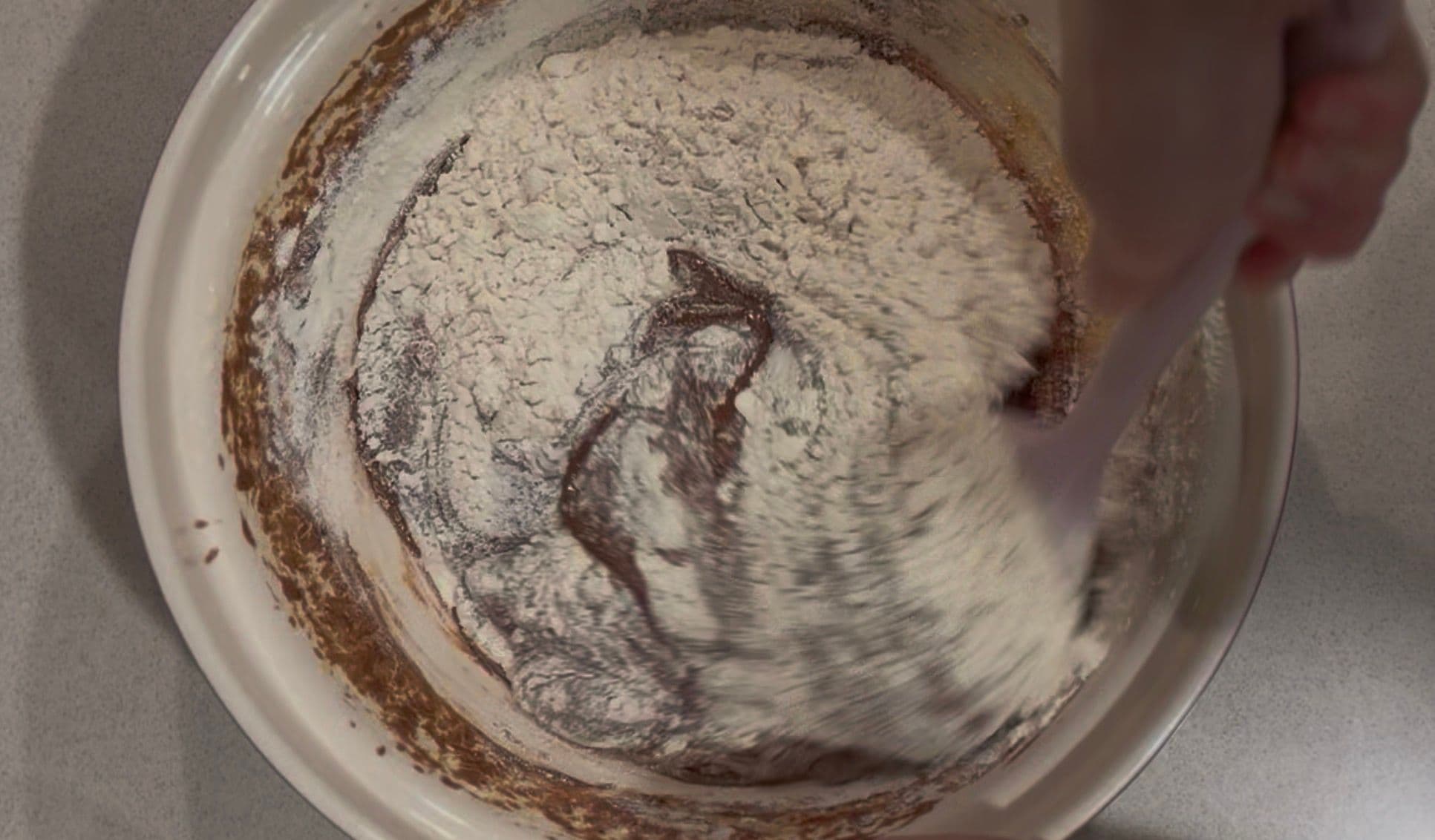 The flour folded in, batter ready for the tin