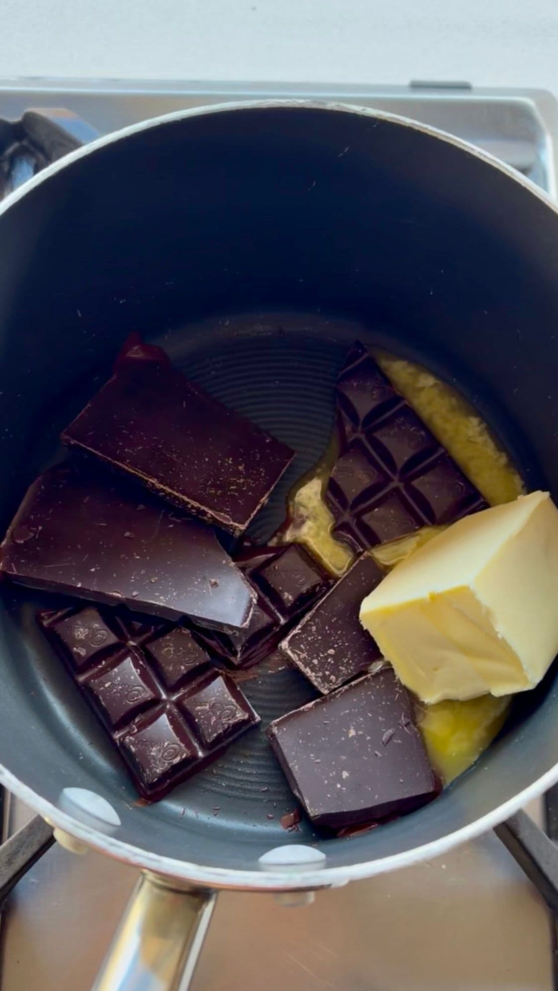 Chocolate and butter beginning to melt in the pan