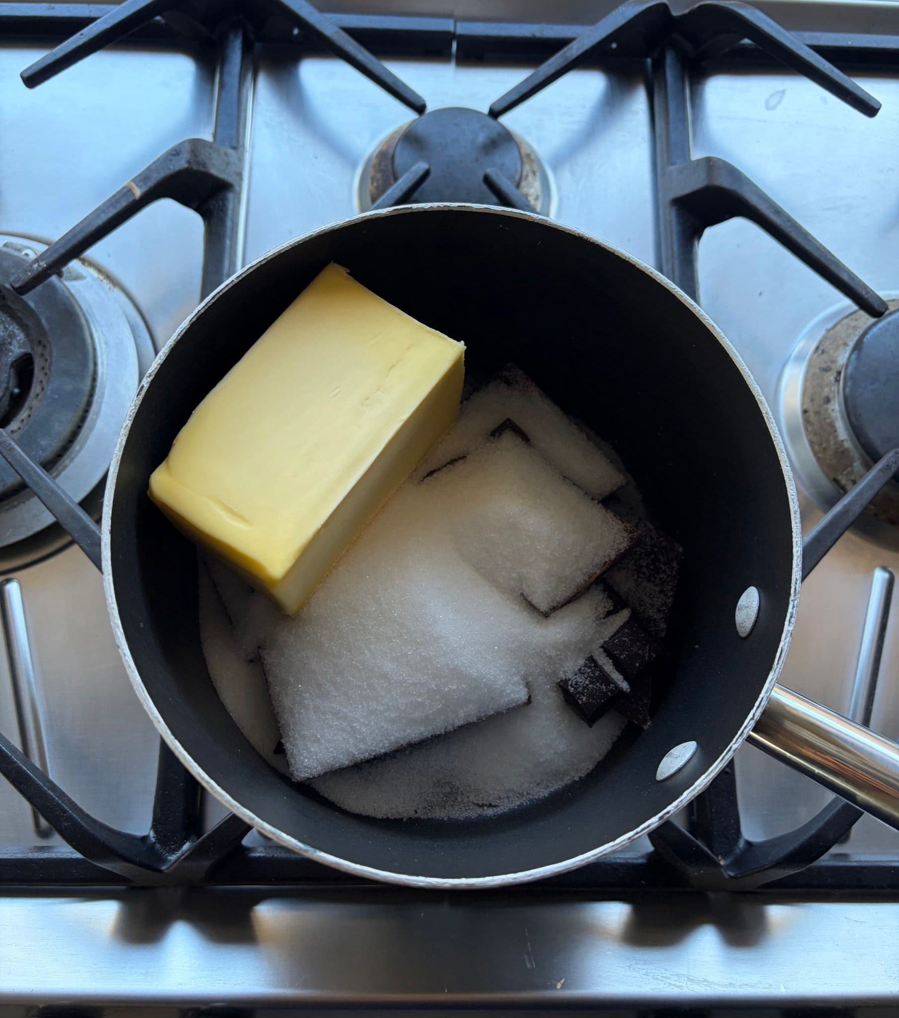 Chocolate, sugar and butter in the pan before melting