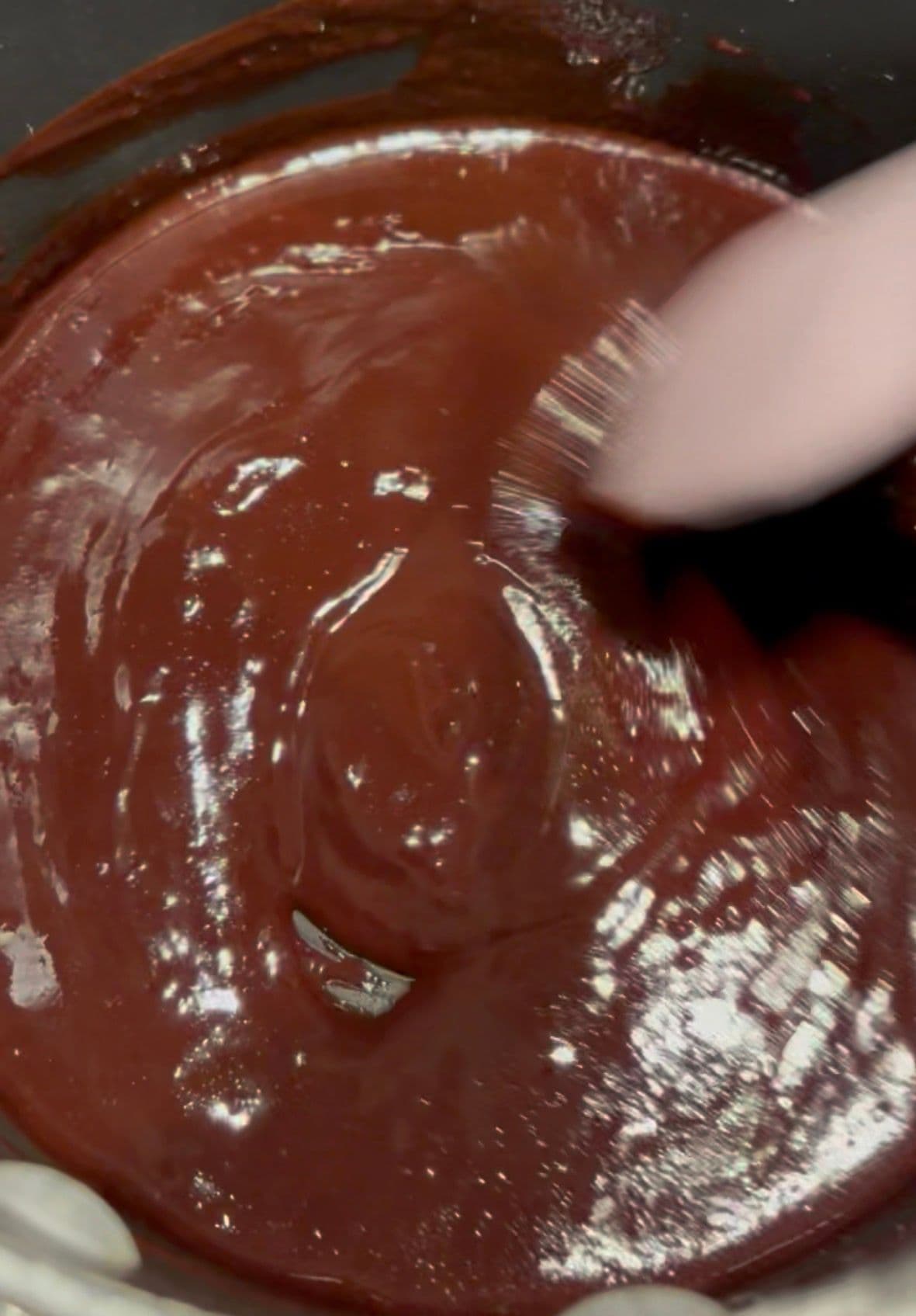 The melted chocolate and butter, smooth
