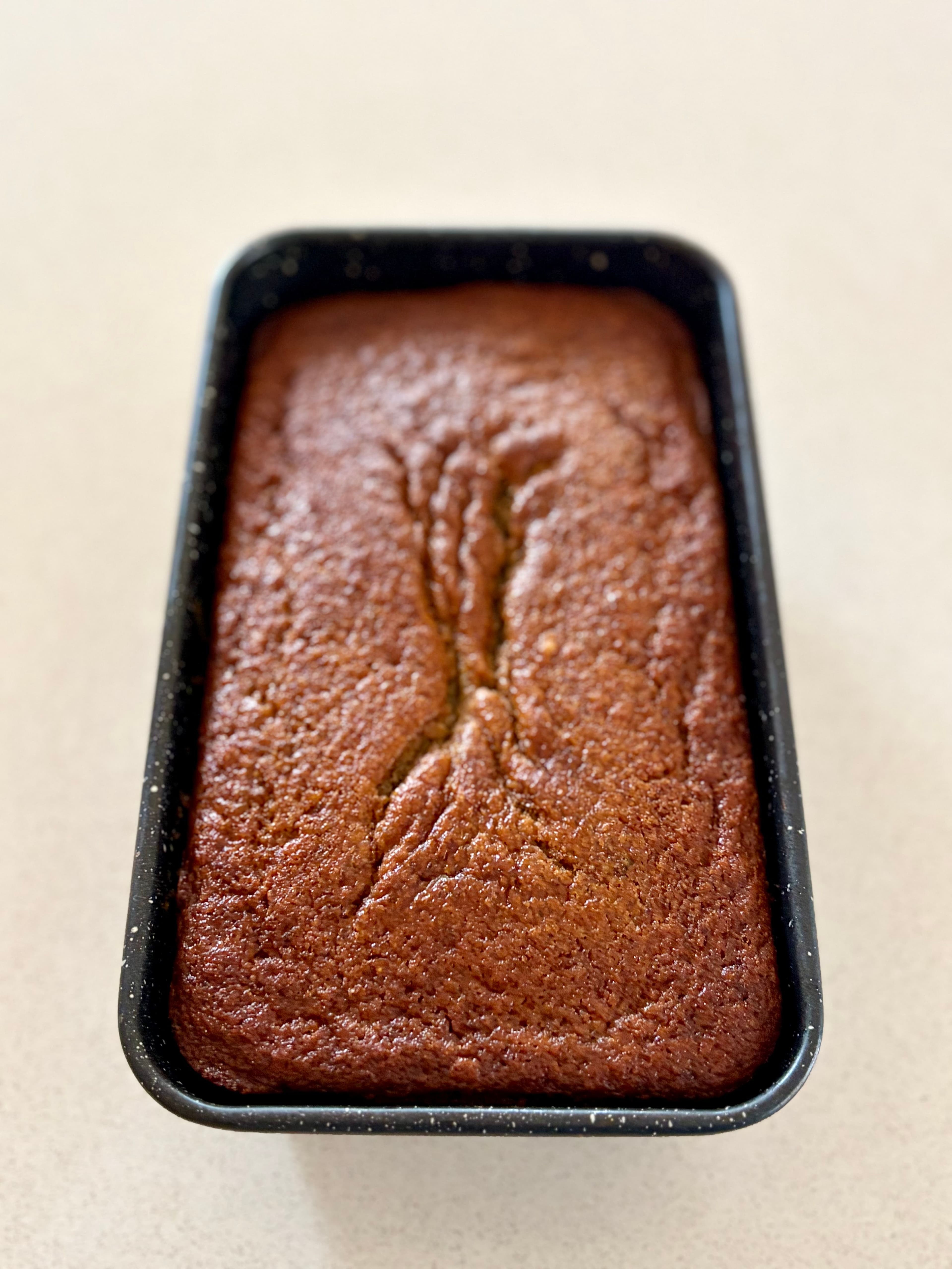 Banana bread cooling in tin