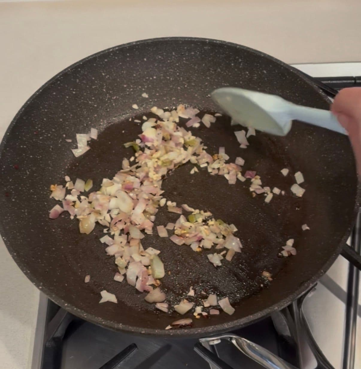 Diced shallots and garlic ready to cook