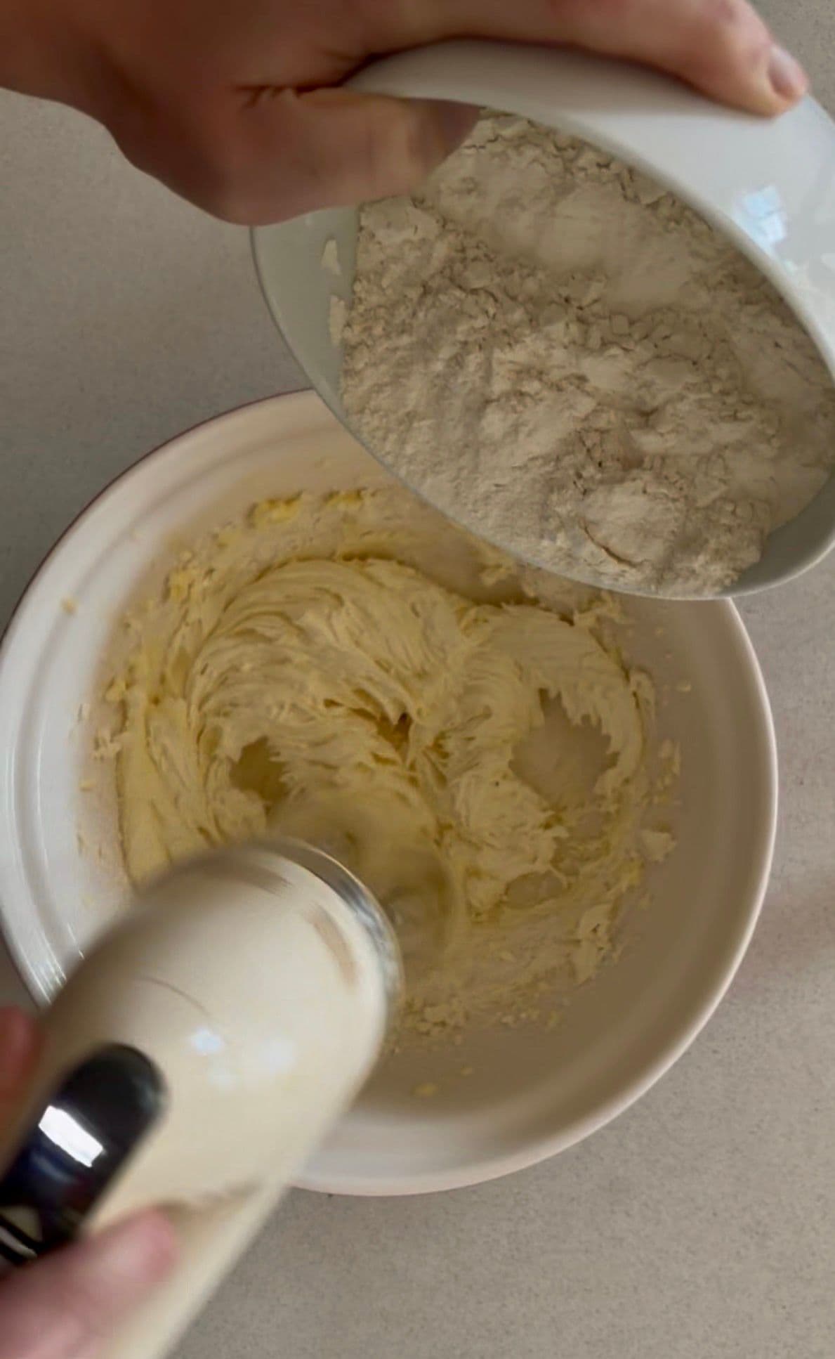 Adding flour to the dough