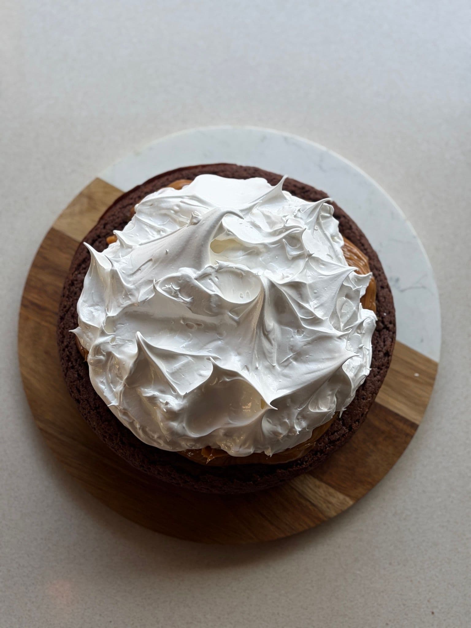Italian meringue swirled over a marquise, before torching