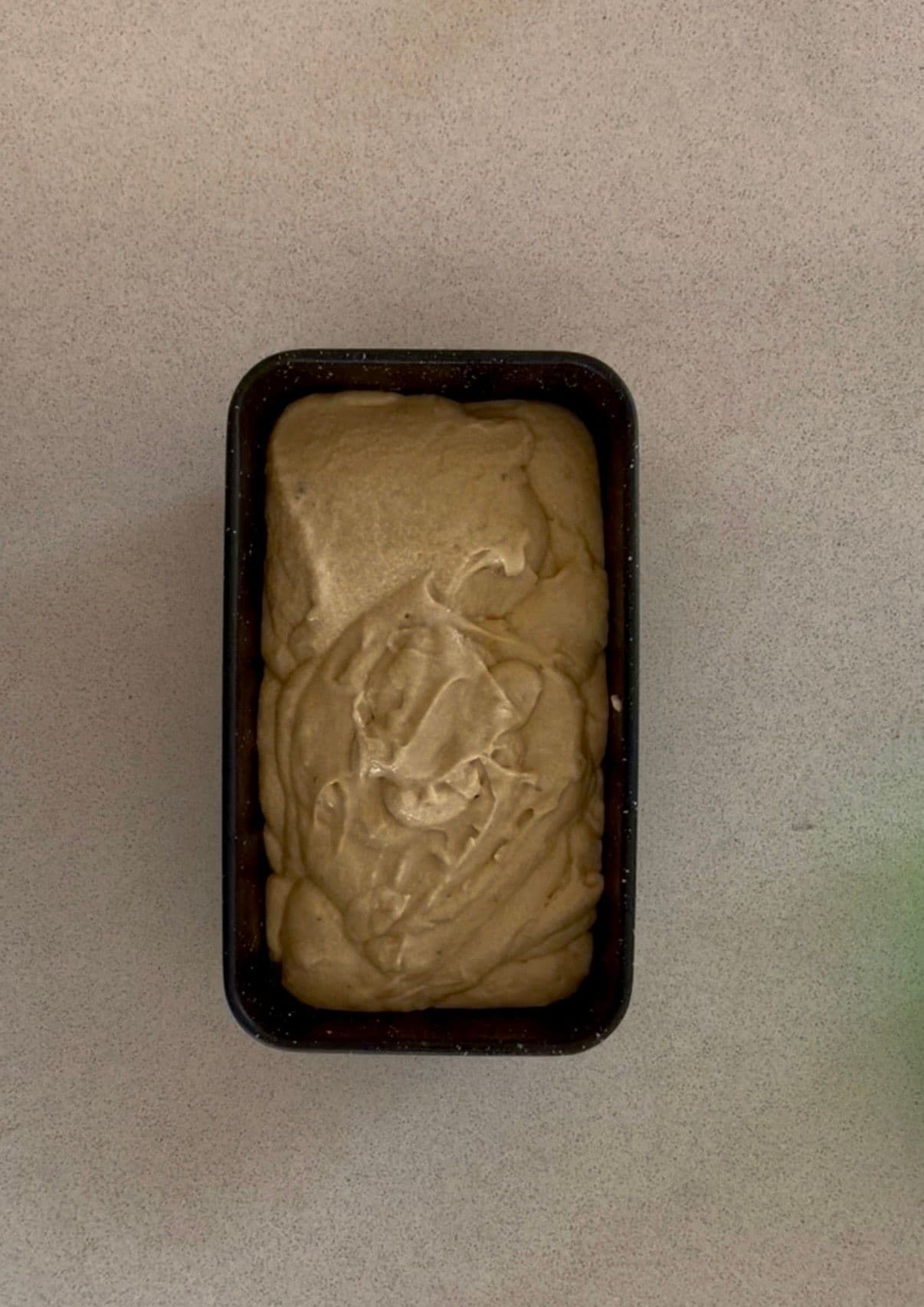 Batter poured into loaf tin