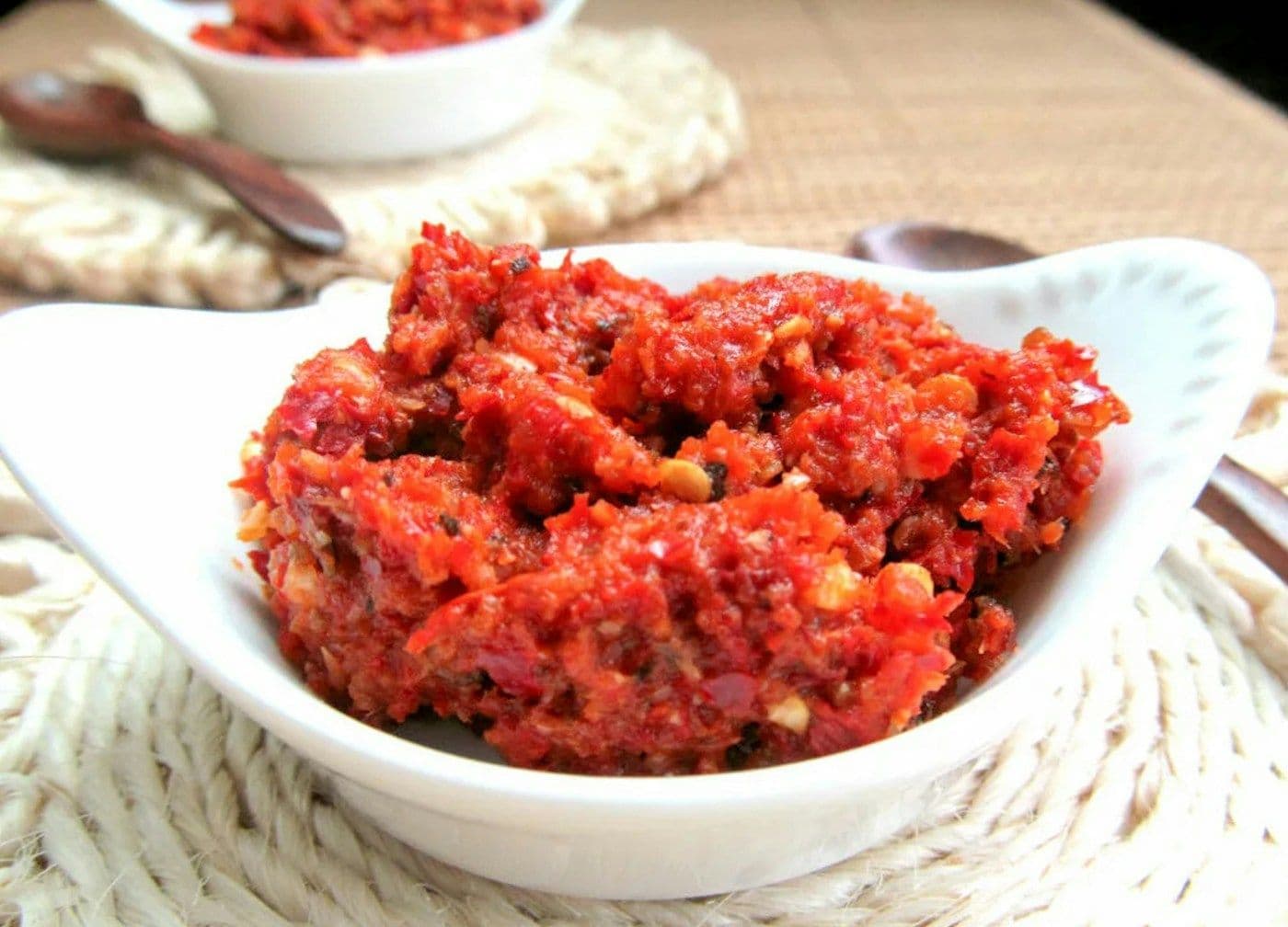 Red chilli paste in a white bowl