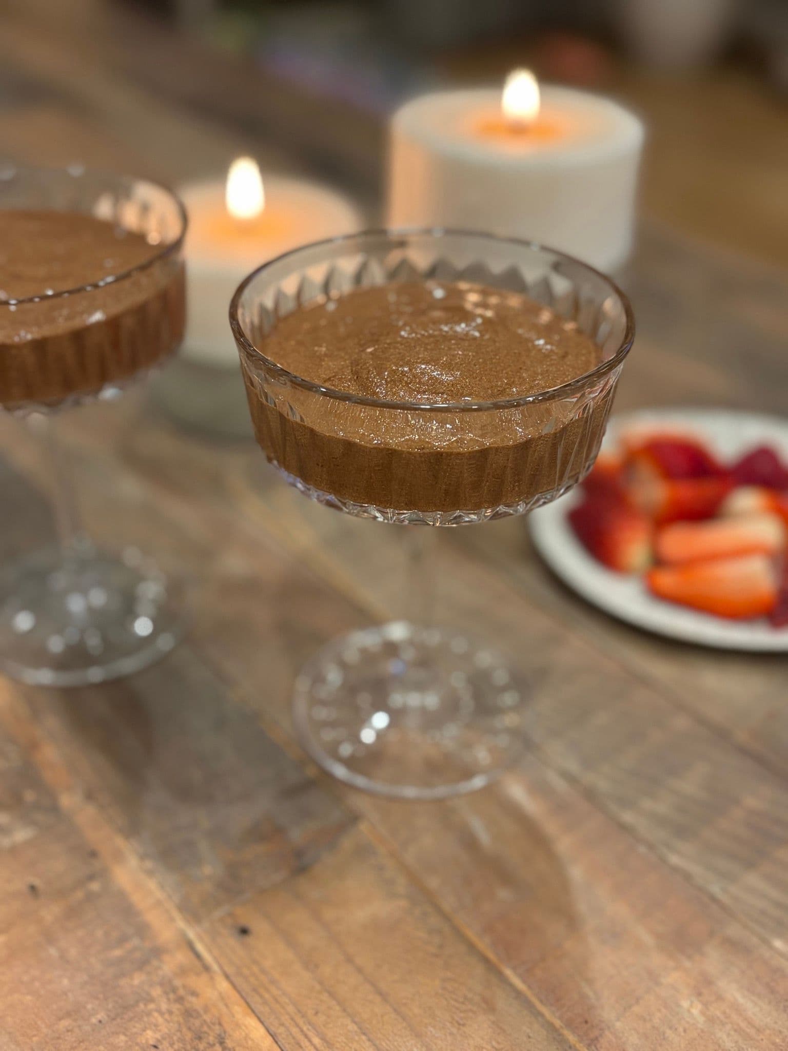 A spoonful of chocolate mousse lifting dulce de leche from the base