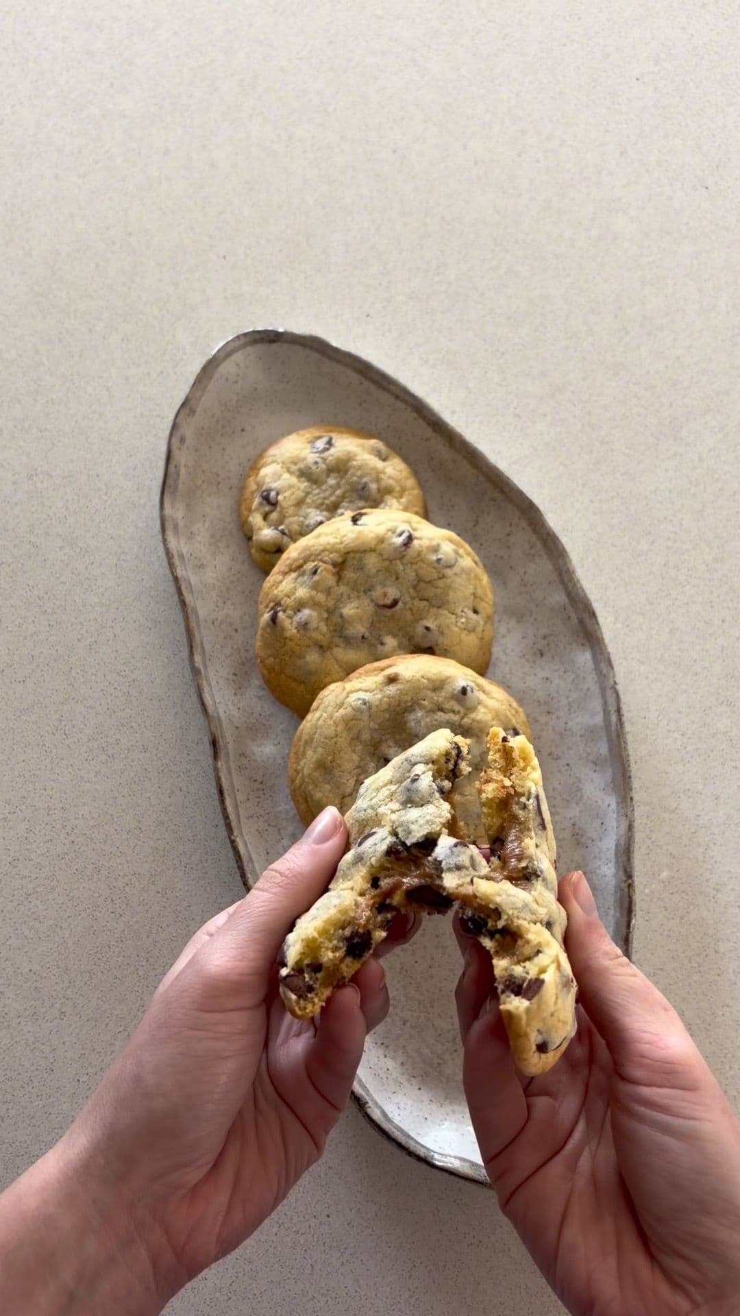 Stack of chocolate chip cookies with dulce de leche filling