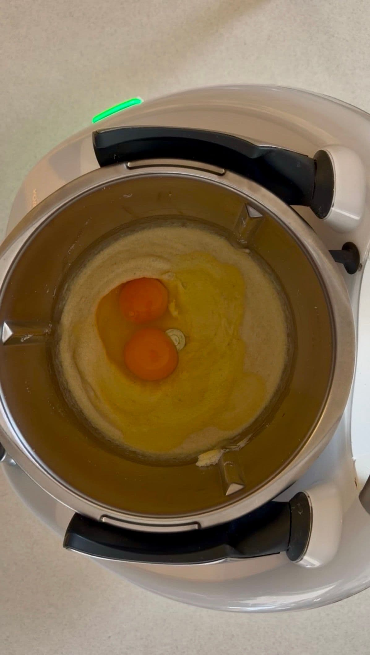 Adding eggs to the food processor